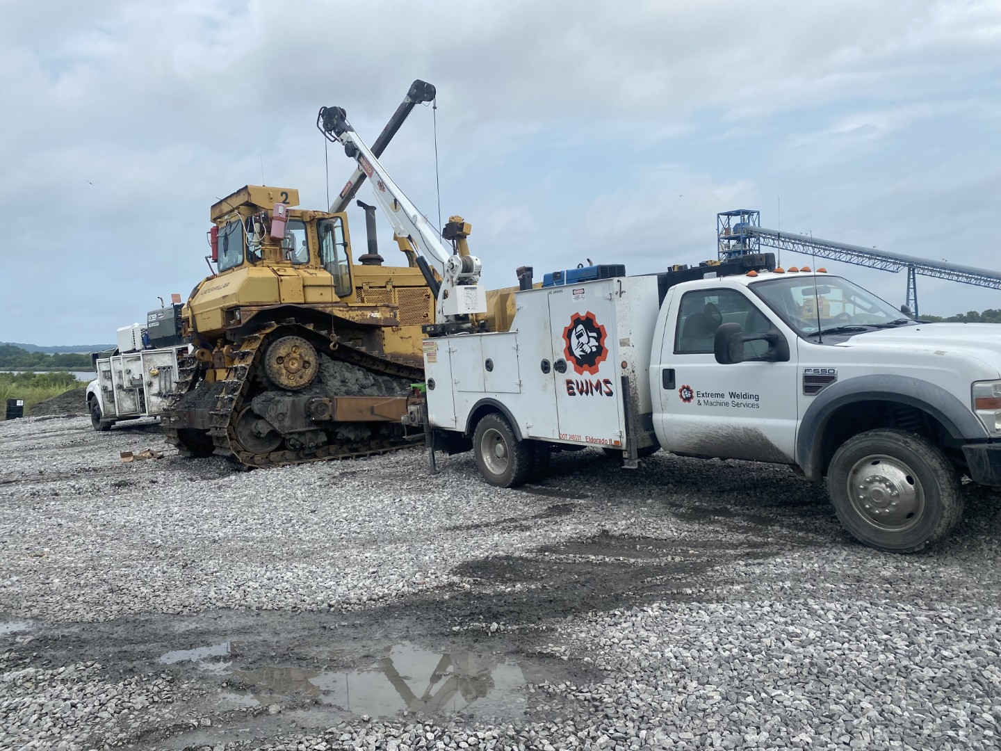 service truck lifting crawler dozer